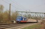 Raildox 185 409-0 mit einem Holzzug Richtung Groheringen, am 21.04.2013 bei der Einfahrt in Naumburg Hbf.