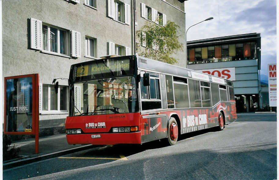 (062'207) - SBC Chur - Nr. 12/GR 97'512 - Neoplan am 29. Juli 2003 in Chur, Post 1