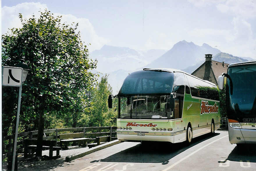 (062'636) - Hrzeler, Dietikon - Nr. 3/ZH 72'429 - Neoplan am 10. August 2003 in Adelboden, Landstrasse