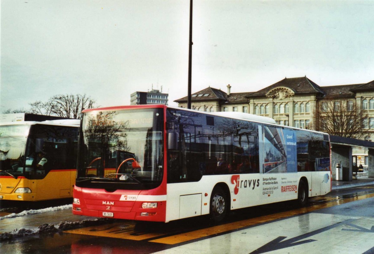 (123'228) - TRAVYS Yverdon - VD 1418 - MAN am 23. Dezember 2009 beim Bahnhof Yverdon