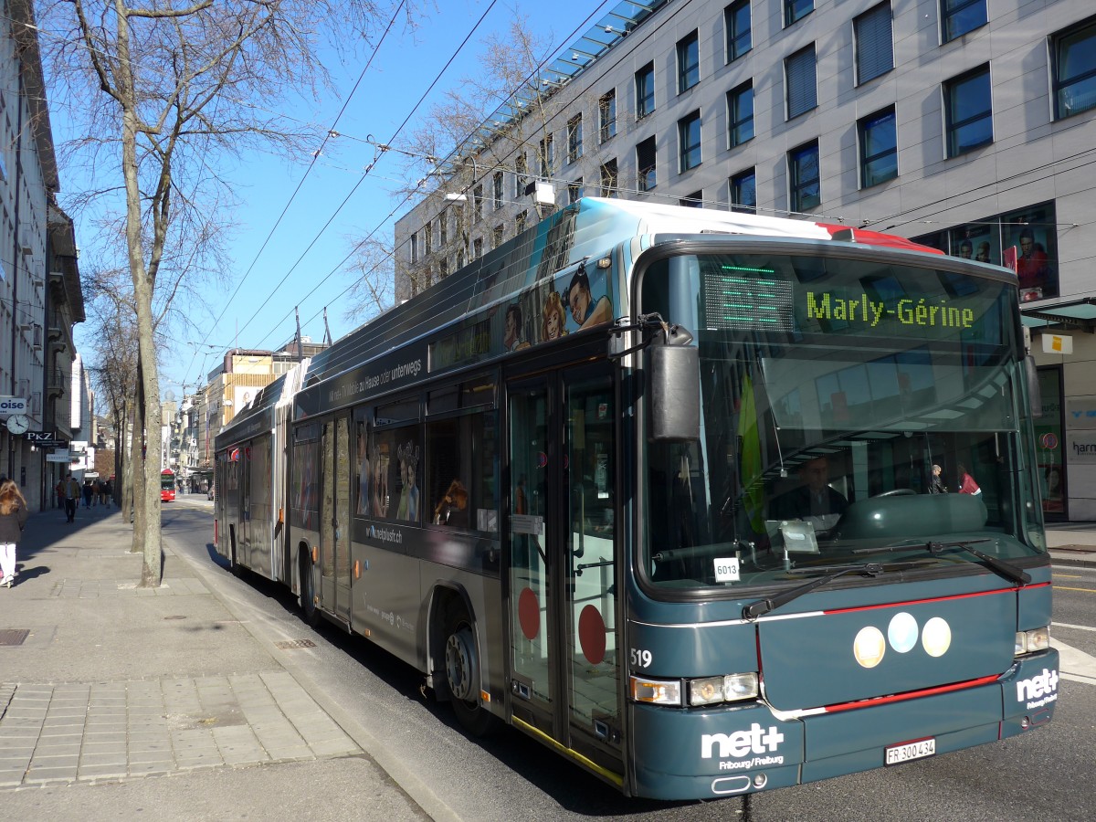 (149'283) - TPF Fribourg - Nr. 519/FR 300'434 - MAN/Hess Gelenkduobus am 9. Mrz 2014 beim Bahnhof Fribourg