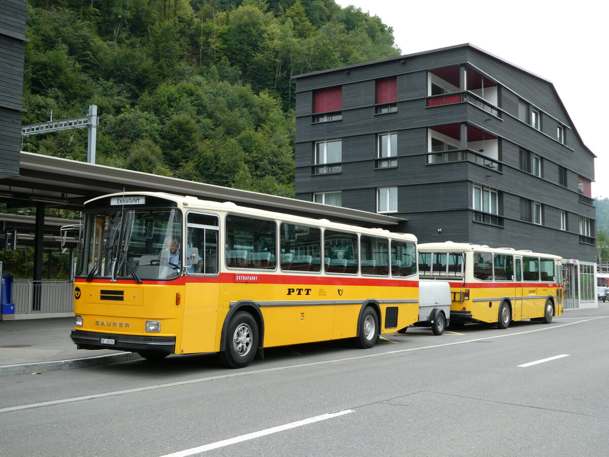 (239'822) - Schmid, Thrishaus - BE 26'206 - Saurer/Tscher (ex P 24'244) am 28. August 2022 beim Bahnhof Giswil