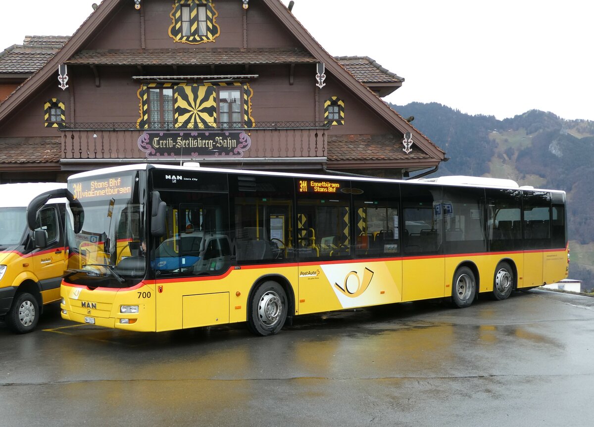 (247'111) - PostAuto Zentralschweiz - Nr. 700/NW 27'617/PID 5569 - MAN (ex Niederer, Filzbach Nr. 12; ex PostAuto Ostschweiz) am 10. Mrz 2023 beim Bahnhof Seelisberg