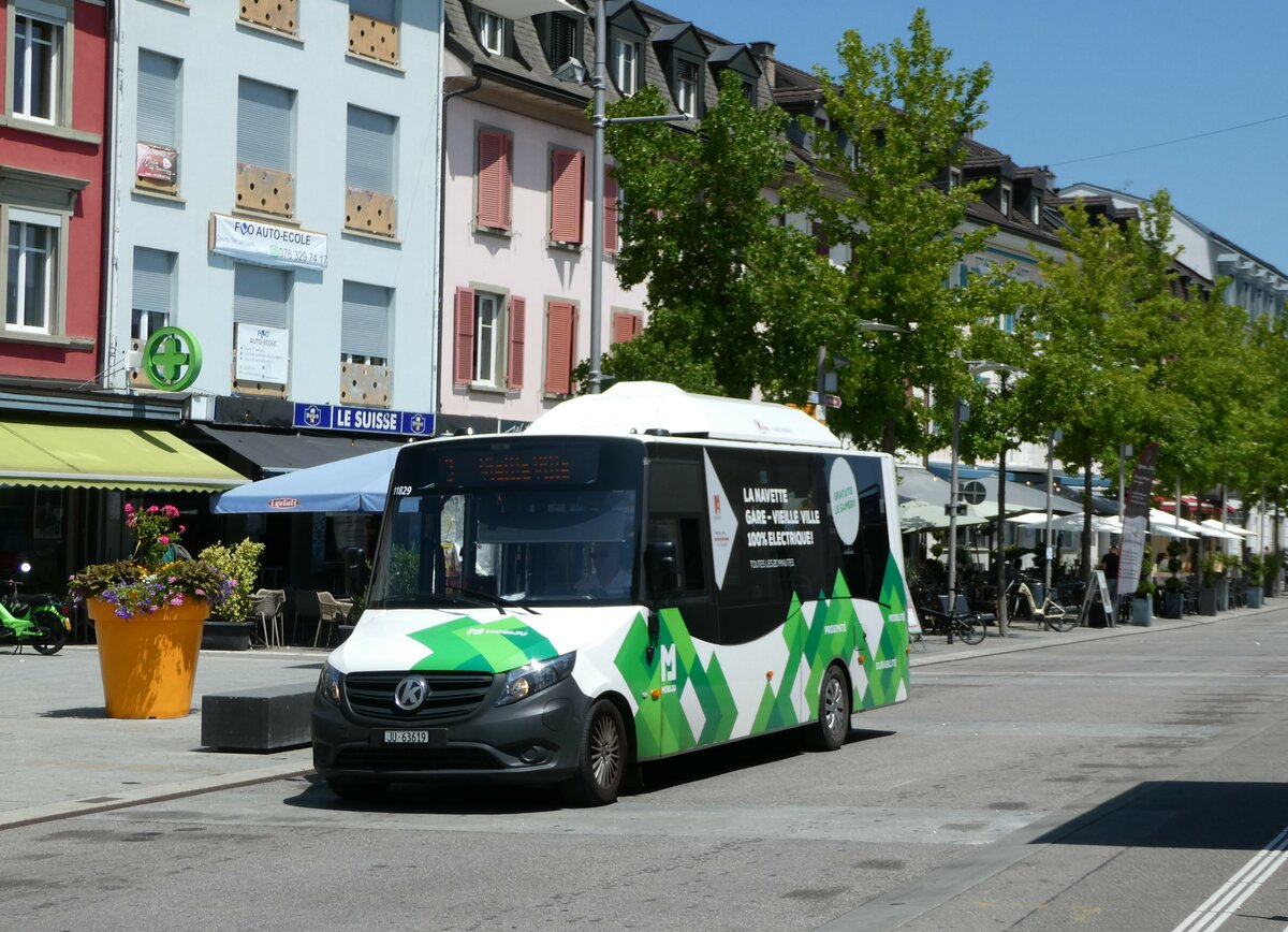 (252'436) - CarPostal Ouest - JU 63'619/PID 11'829 - K-Bus am 7. Juli 2023 beim Bahnhof Delmont