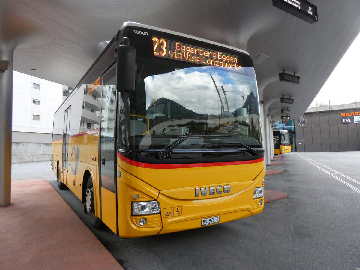 (267'793) - BUS-trans, Visp - VS 97'000/PID 10'088 - Iveco am 6. Oktober 2024 beim Bahnhof Visp