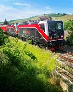 EBS 110 001-5 berfhrte am 25.05.2022 eine EBS 156er und 143 124-6 und 143 056-0 von Naumburg (S) Hbf nach Karsdorf.